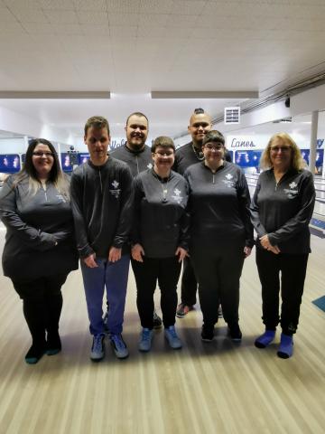 Group photo of bowling team at bowling alley